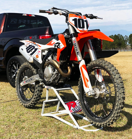 KTM dirt bike resting on the risk racing ride-on lift