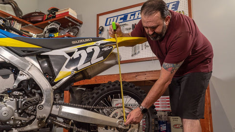 Measuring sag on a dirt bike. Run a tape measure from the recommended spot on the rear fender to the rear axle of your motorcycle.