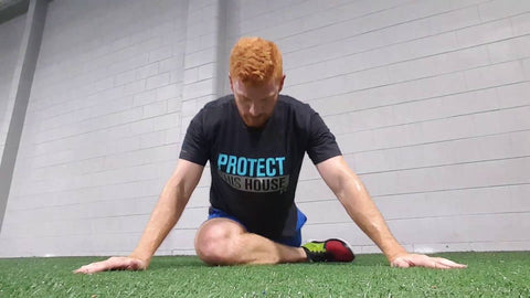 motocross rider practicing yoga at the gym to benefit his performance on the motocross track.