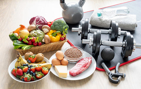 Important foods for athletes placed next to basic exercise equipment.