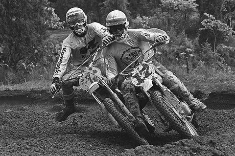 Vintage motocross racers on motocross track