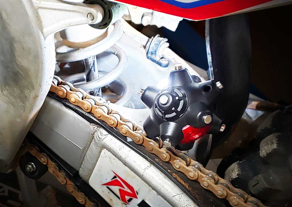 well lit dirt bike suspension rear swing arm area using a Magnetic light mine pro from STKR Concepts
