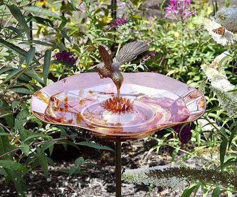 A copper hummingbird birdbath