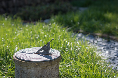 A sundial in the grass