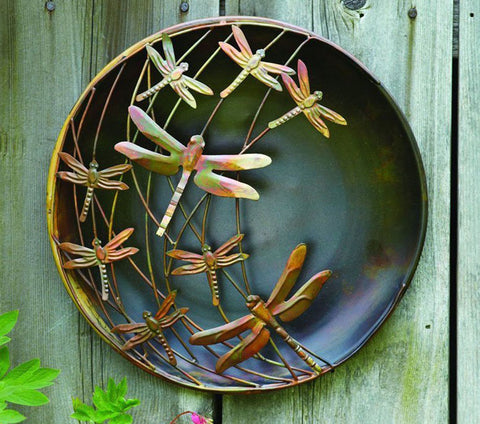 Dragonfly wall decor in a metal finish.