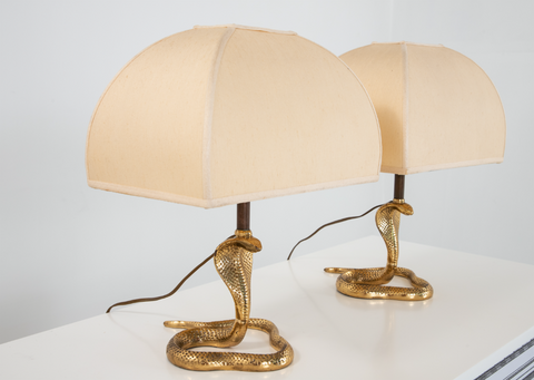 A pair of 1970s French brass cobra table lamps