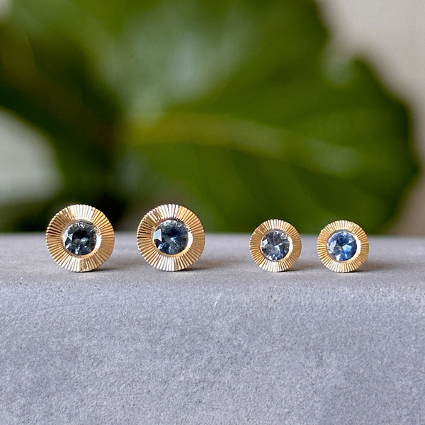 The Extra Large Aurora Stud Earrings vs Large Aurora Stud Earrings with blue Montana sapphires