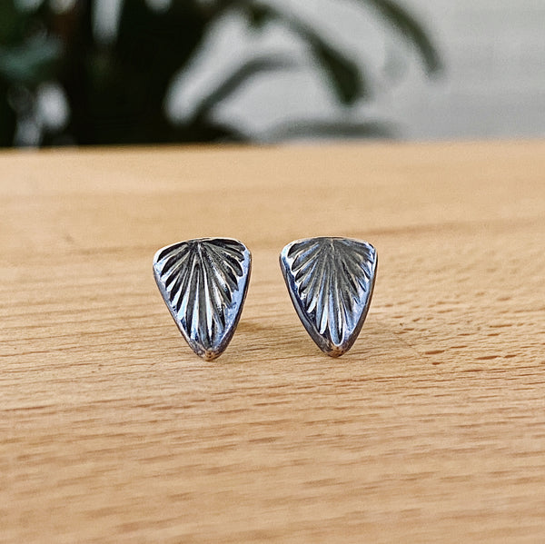 https://coreyegan.com/collections/stud-earrings/products/oxidized-silver-spark-studs