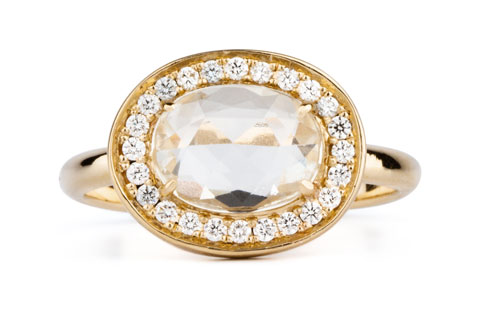 Oval white rose cut sapphire halo ring in yellow gold