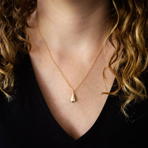 14k yellow Gold Crystal Fragment Necklace around a neck