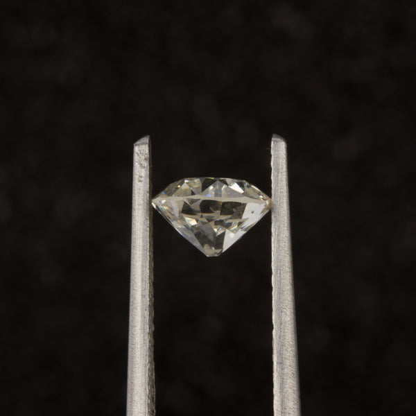 Old European Cut Diamond in Tweezers - Side View