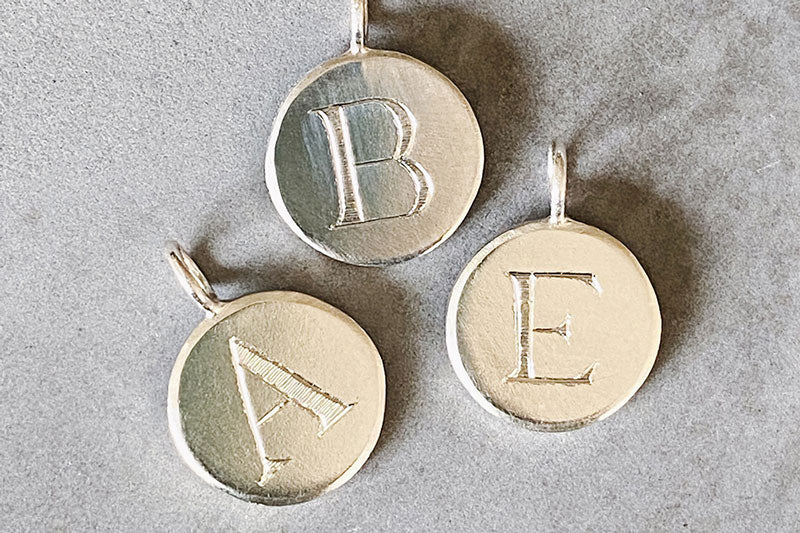 Initial Pendants in silver with engraved block letter