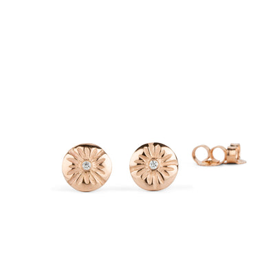 14k rose gold lucia stud earrings with white diamond centers on a white background