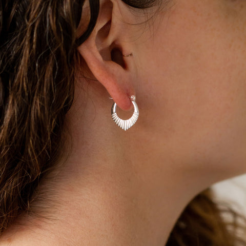 Small Silver petal shaped sunburst hoop earrings with hinge closure