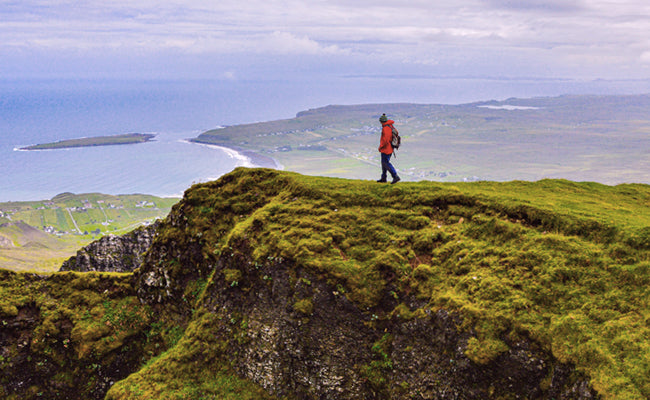 A hiker walking along a ridge