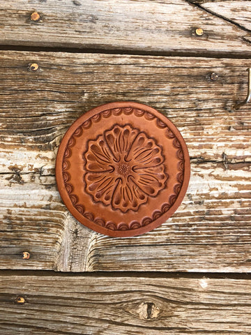 Leather coaster with floral design