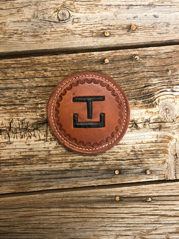 Leather coaster with brand