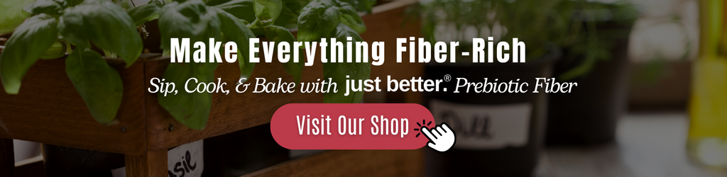 Fresh potted herbs in a wooden slat box with a text overlay that reads: Make Everything Fiber-Rich. Sip, Cook, and Bake with just better prebiotic fiber.