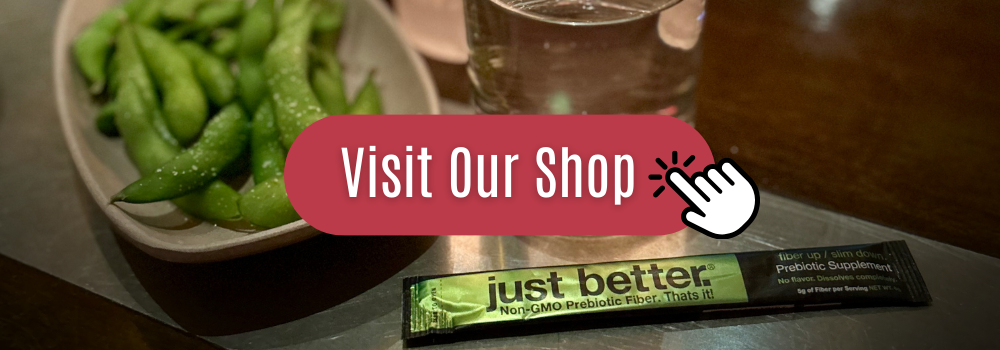 A clickable picture to our shop. Background of edamame with a stick pack of just better.® Prebiotic Fiber.