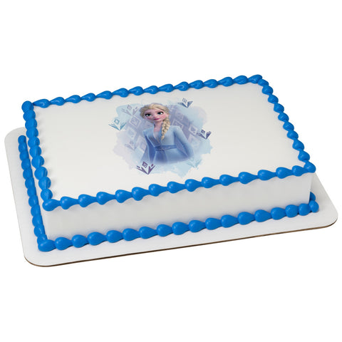 Edible image of Elsa from Disney's Frozen on a cake.