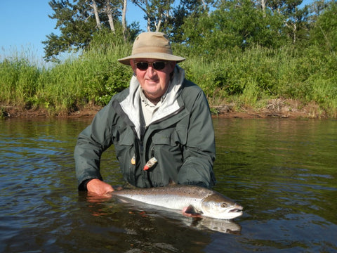 Fishermen holding large Salmon