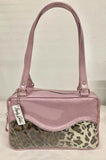 The Diamond Pleat Tuck and Roll Tote in Blush Pink Glitter Vinyl and Leopard with clear overlay lined with matching plush leopard is handcrafted in California with nickel hardware and 25” straps plus it comes with replacement straps. Inside open divided pocket and inside zipper pocket with serial number hidden inside. Nickel feet, vinyl zipper pull, and signature Trophy Queen Label included. The perfect size bag for any trip!