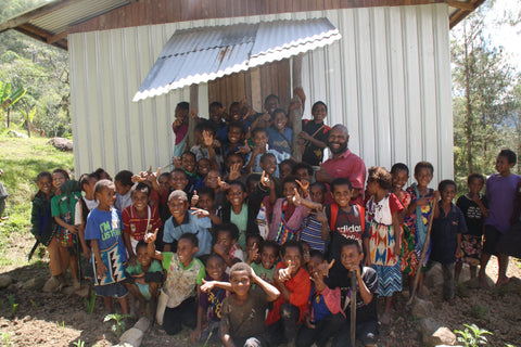 Teacher and children at community school - Fairtrade Premium Investment