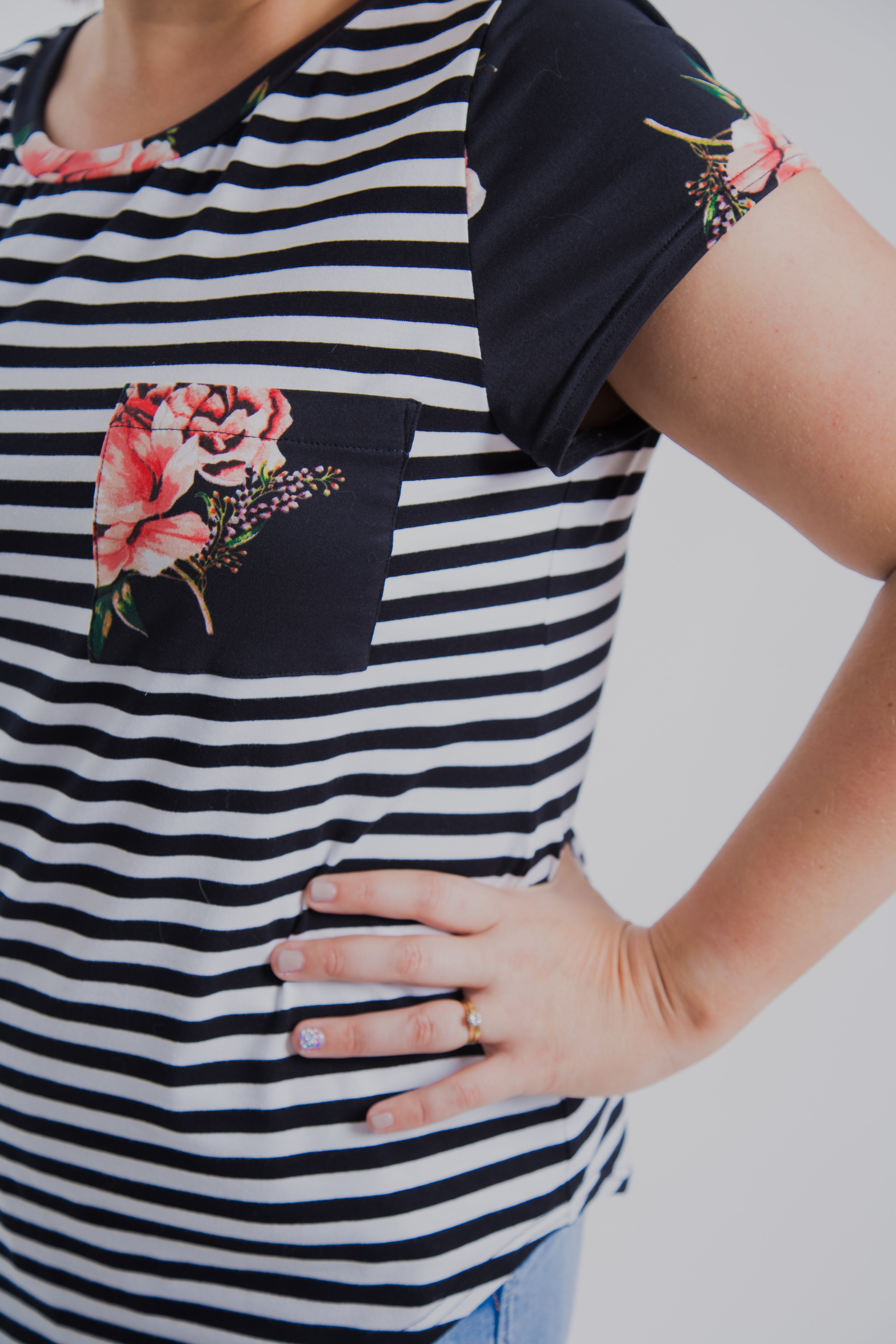 black and white striped shirt with floral sleeves