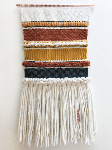 this woven wallhanging includes a variation on a twill weave as well as basic weave and rya knots