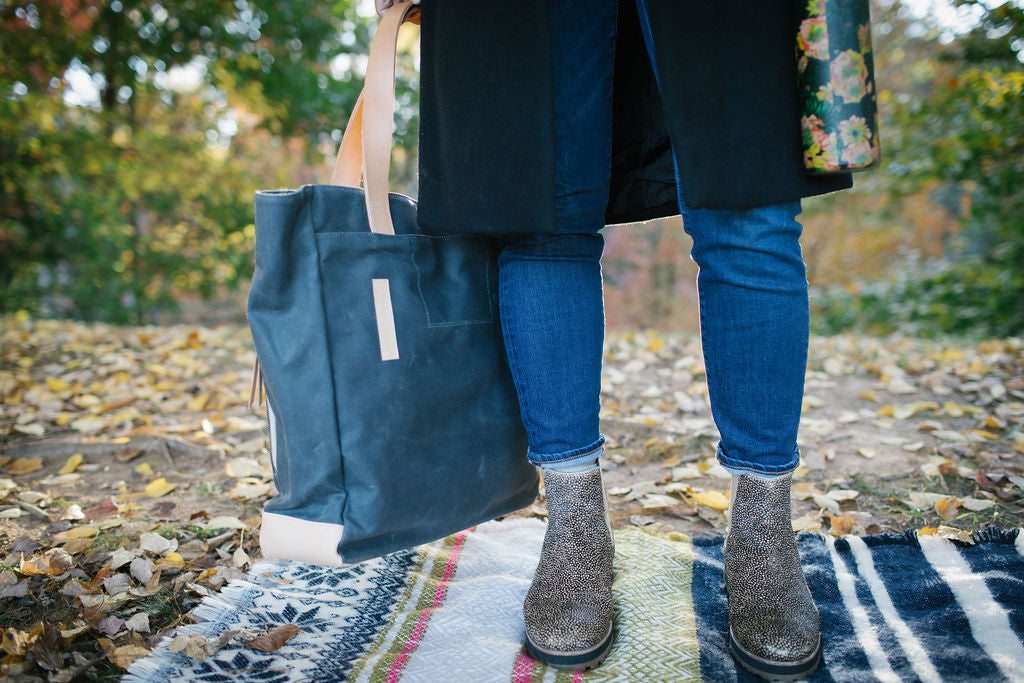 Charcoal gray tote bag from Notebooks and Honey with fall leaves