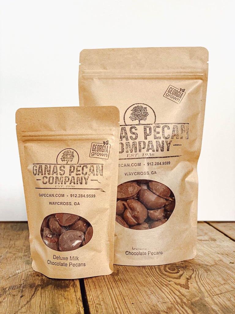 https://cdn.shopify.com/s/files/1/2312/6181/products/DeluxeMilkChocolatePecans_1024x1024.jpg?v=1601911821