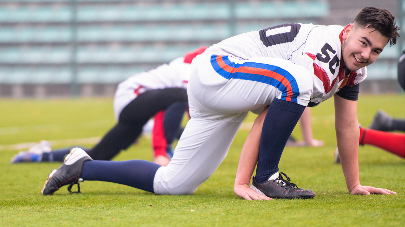 American Football Players Stretching and Warming up