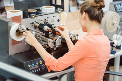 woman printing product labels
