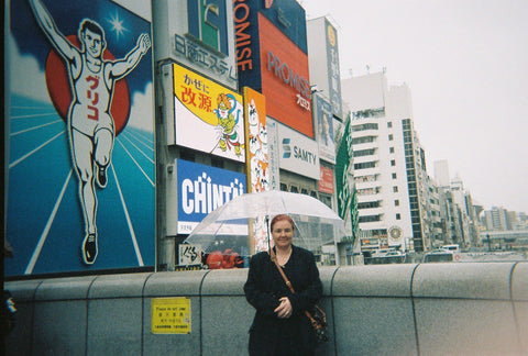 Mother Isabella Schimid in Shinjuku, in front of the neon lights of Tokyo