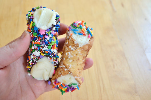 fresh filled decorated golden cannoli shells