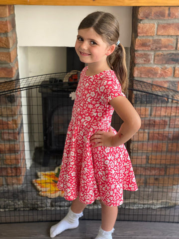 Robyn wearing the aw21 frugi watermelon skater dress