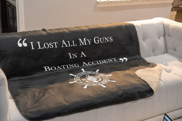 I lost all my guns in a boating accident sherpa throw blanket on couch