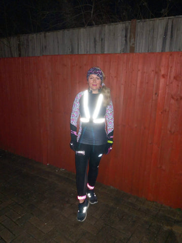 BTR running high vis vest and sash worn by woman in the dark