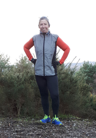 BTR high vis reflective gilet with three zipped pockets worn in daytime by a woman