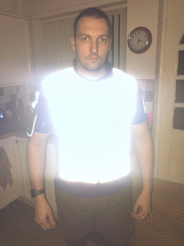 btr reflective cycling and running gilet being worn by a customer to demonstrate how high vis it is