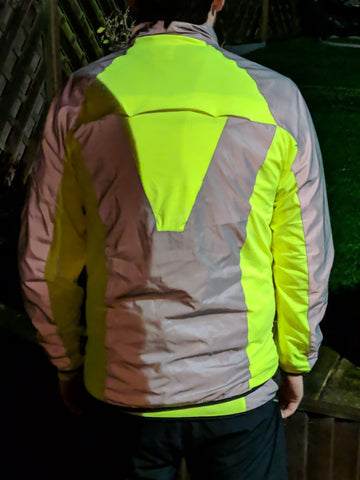 High vis & reflective cycling jacket shown worn , bright high vis