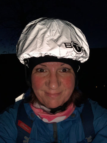 BTR high vis reflective bicycle helmet cover worn by lady in the evening