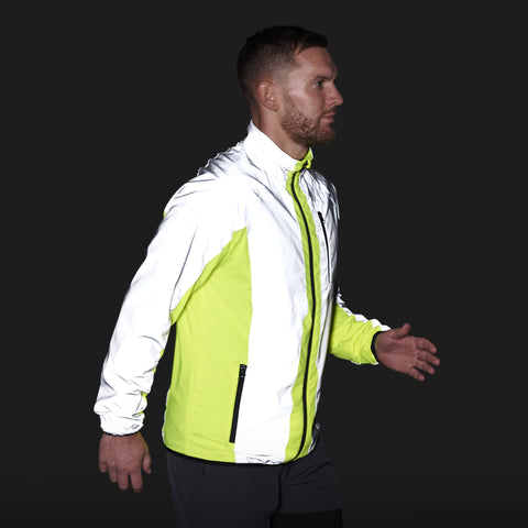 High Vis & Reflective Jacket from BTR shown on side view in the dark with reflective panels shining in the dark