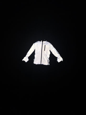 BTR reflective high viz jacket being worn in the dark reflecting brilliantly