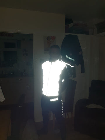 Be Totally Reflective Gilet shown in the dark from BTR 