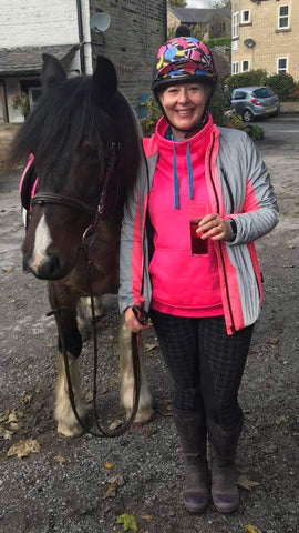 BTR pink reflective high vis jacket worn by a lady horse rider