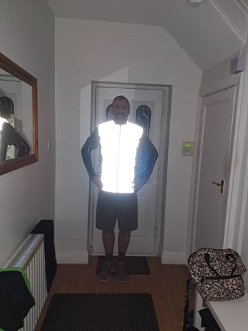 Danny in our Be Totally Reflective Gilet reflecting bright - customer photo