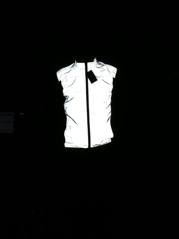 BTR reflective silver high vis running and cycling gilet worn by man in the dark