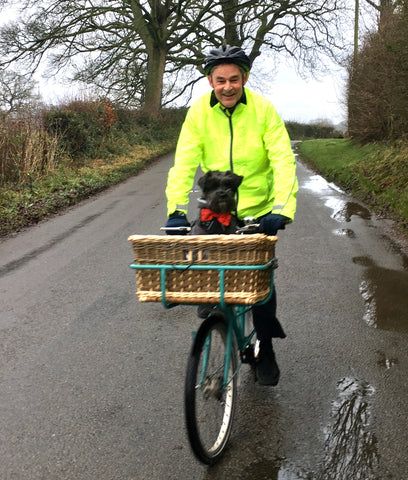 BTR high vis jacket shown on a bike - with a dog in a basket! Be seen 