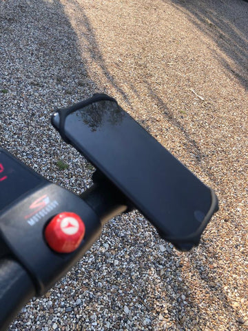 BTR phone holder mount being used to hold an iphone 7 on a golfing trolley
